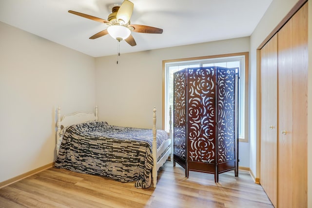 15521 Foghorn Ln, Apple Valley, MN 55124 - bedroom with light wood finished floors, a closet, and a ceiling fan