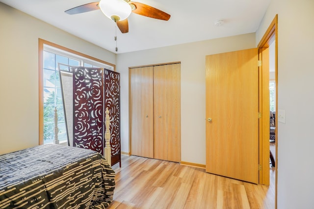 15521 Foghorn Ln, Apple Valley, MN 55124 - bedroom featuring light wood-style floors, a closet, and ceiling fan