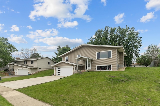 4990 148th Path W, Apple Valley, MN 55124 - view of front of home featuring a garage, concrete driveway, and a front yard