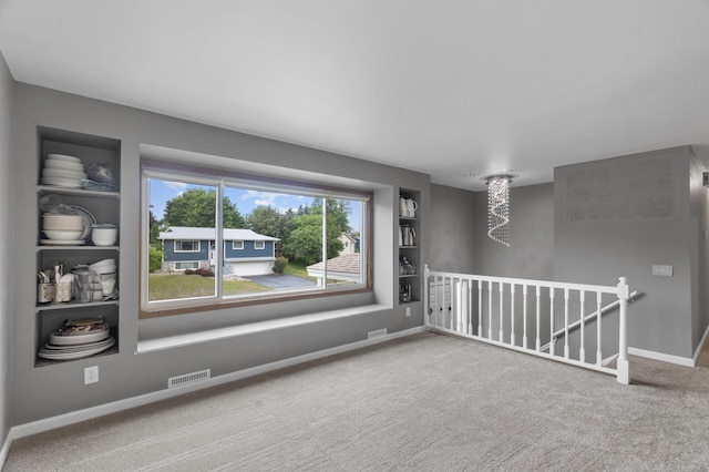 4990 148th Path W, Apple Valley, MN 55124 - carpeted spare room featuring built in features and baseboards