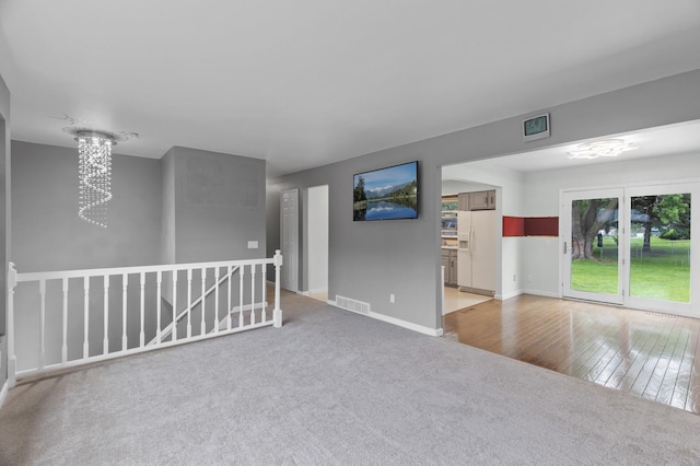 4990 148th Path W, Apple Valley, MN 55124 - unfurnished room featuring carpet and a chandelier