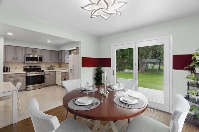 4990 148th Path W, Apple Valley, MN 55124 - dining space featuring a chandelier, recessed lighting, and light wood-style floors