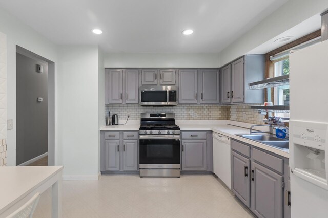 4990 148th Path W, Apple Valley, MN 55124 - kitchen featuring appliances with stainless steel finishes, gray cabinets, tasteful backsplash, light countertops, and recessed lighting