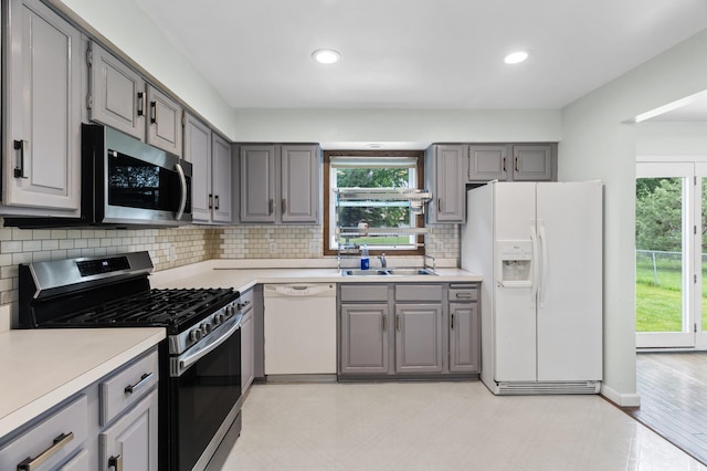 4990 148th Path W, Apple Valley, MN 55124 - kitchen with stainless steel appliances, gray cabinetry, plenty of natural light, light countertops, and recessed lighting