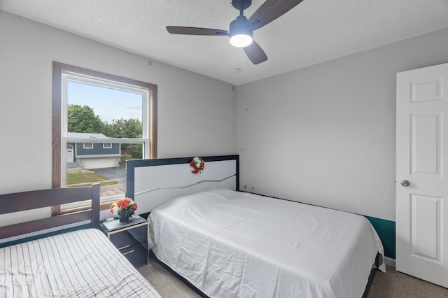 4990 148th Path W, Apple Valley, MN 55124 - carpeted bedroom with ceiling fan and a textured ceiling