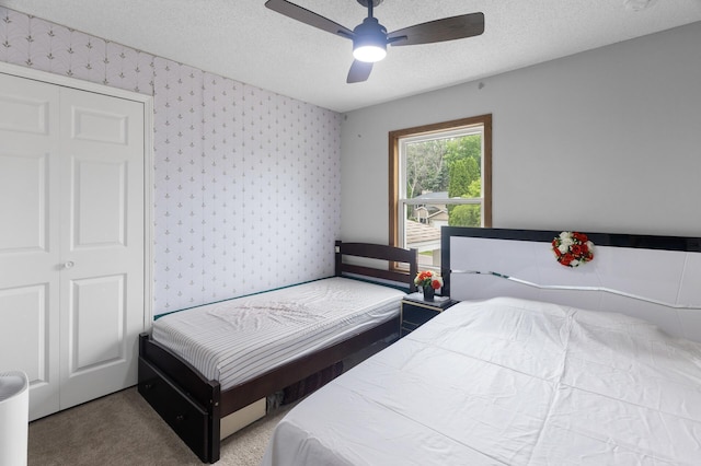 4990 148th Path W, Apple Valley, MN 55124 - bedroom with wallpapered walls, a textured ceiling, carpet floors, and ceiling fan