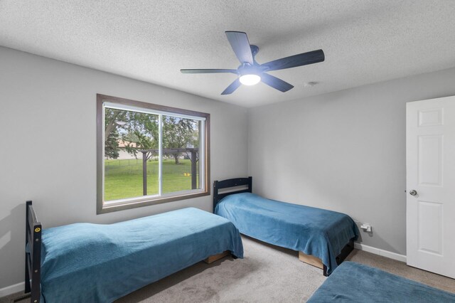 4990 148th Path W, Apple Valley, MN 55124 - carpeted bedroom featuring ceiling fan and a textured ceiling