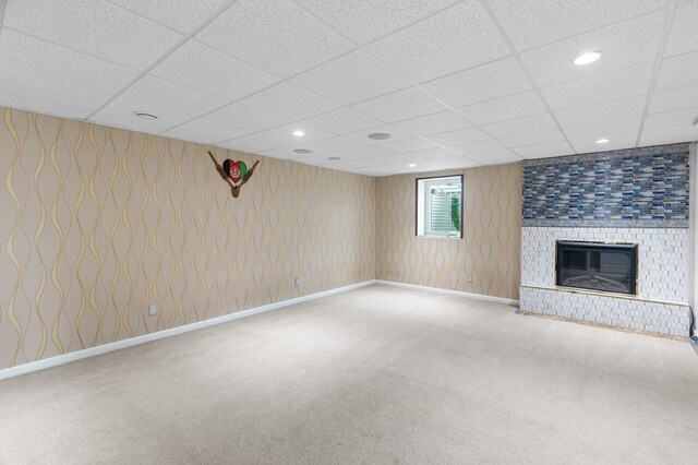 4990 148th Path W, Apple Valley, MN 55124 - unfurnished living room featuring a drop ceiling, carpet floors, a brick fireplace, and recessed lighting