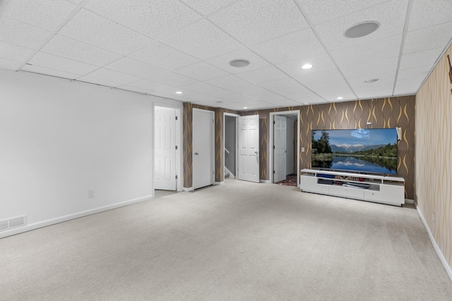 4990 148th Path W, Apple Valley, MN 55124 - unfurnished living room featuring carpet, a drop ceiling, recessed lighting, and wooden walls
