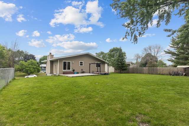 4990 148th Path W, Apple Valley, MN 55124 - back of house featuring a patio, a chimney, and a fenced backyard