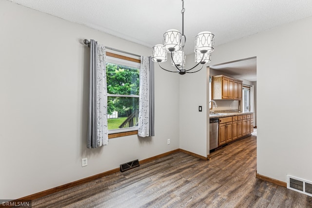 7216 Vinewood Ln N, Maple Grove, MN 55311 - unfurnished dining area with a chandelier and dark wood-type flooring
