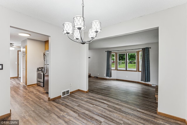 7216 Vinewood Ln N, Maple Grove, MN 55311 - spare room with a chandelier, wood finished floors, and ceiling fan