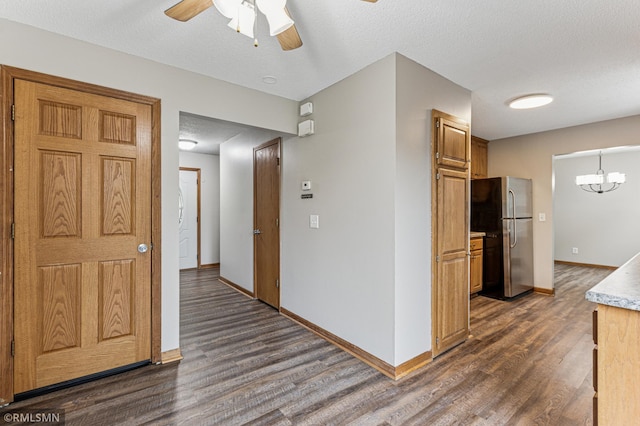 7216 Vinewood Ln N, Maple Grove, MN 55311 - kitchen with freestanding refrigerator, dark wood-style flooring, a ceiling fan, light countertops, and brown cabinetry