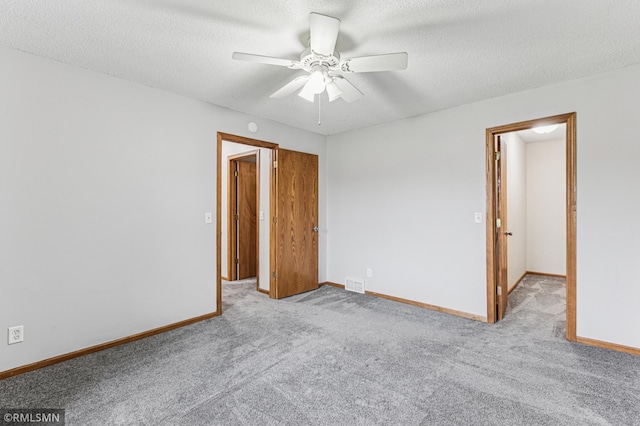 7216 Vinewood Ln N, Maple Grove, MN 55311 - carpeted spare room featuring ceiling fan and a textured ceiling