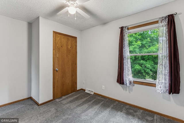 7216 Vinewood Ln N, Maple Grove, MN 55311 - carpeted empty room with a textured ceiling and a ceiling fan