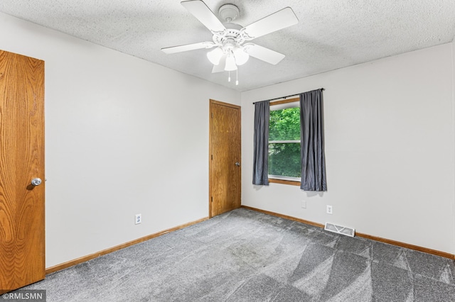 7216 Vinewood Ln N, Maple Grove, MN 55311 - spare room with carpet floors, ceiling fan, and a textured ceiling