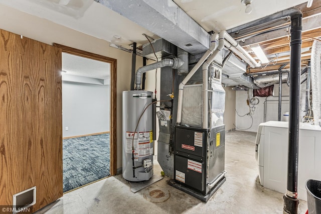 7216 Vinewood Ln N, Maple Grove, MN 55311 - utility room featuring water heater, washing machine and dryer, and heating unit
