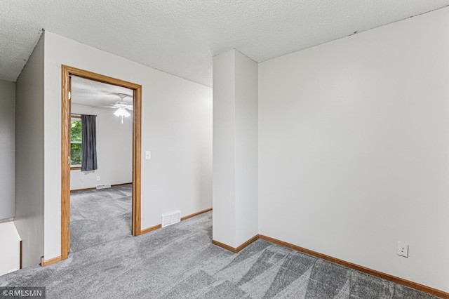 7216 Vinewood Ln N, Maple Grove, MN 55311 - empty room with carpet, a textured ceiling, and a ceiling fan