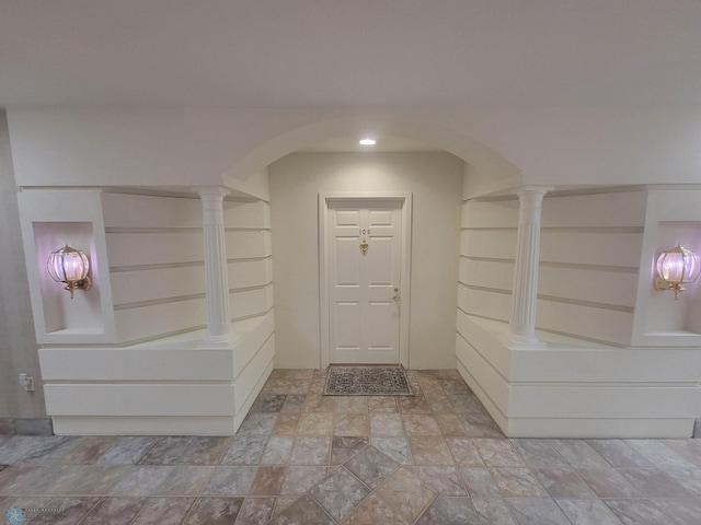 2501 30th Ave S Unit 109, Fargo, ND 58103 - entryway with arched walkways, decorative columns, and stone finish flooring