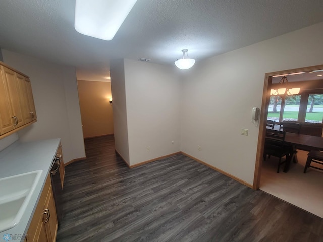2501 30th Ave S Unit 109, Fargo, ND 58103 - unfurnished dining area featuring dark wood-style floors and a textured ceiling