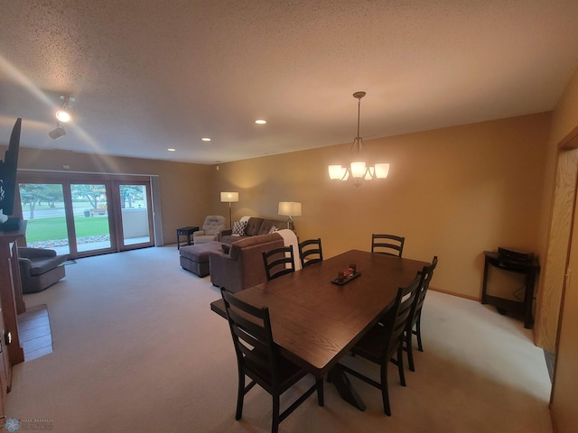 2501 30th Ave S Unit 109, Fargo, ND 58103 - dining area featuring light colored carpet, recessed lighting, and a chandelier