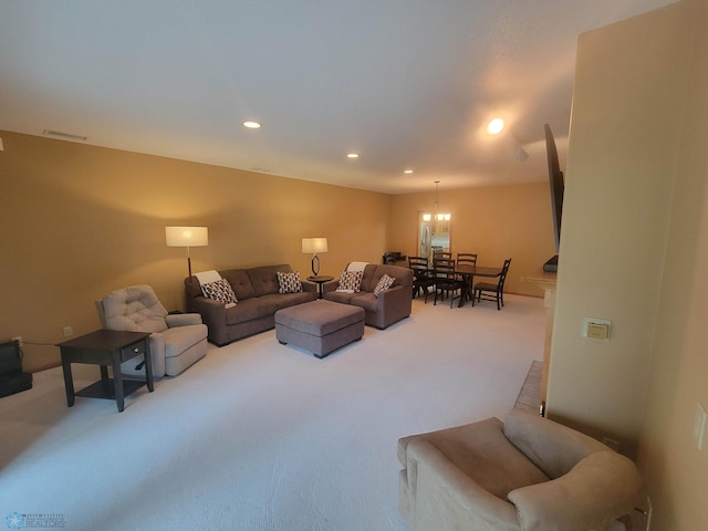 2501 30th Ave S Unit 109, Fargo, ND 58103 - carpeted living room with recessed lighting and a chandelier