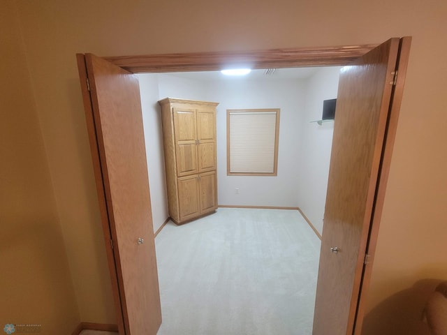 2501 30th Ave S Unit 109, Fargo, ND 58103 - below grade area featuring light colored carpet and baseboards