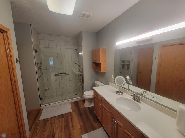 2501 30th Ave S Unit 109, Fargo, ND 58103 - bathroom featuring wood finished floors, a stall shower, and vanity