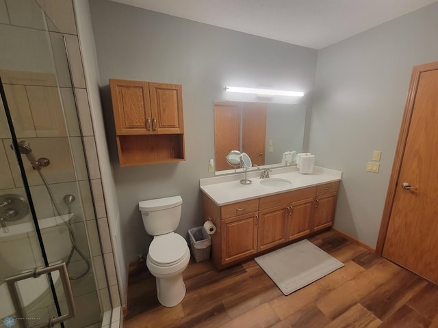 2501 30th Ave S Unit 109, Fargo, ND 58103 - bathroom with a shower stall, wood finished floors, and vanity