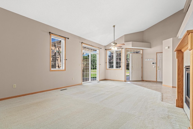 42 Pullman Ave, Saint Paul Park, MN 55071 - unfurnished living room with light colored carpet, lofted ceiling, and a ceiling fan