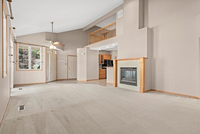 42 Pullman Ave, Saint Paul Park, MN 55071 - unfurnished living room with light carpet, a ceiling fan, lofted ceiling, and a fireplace
