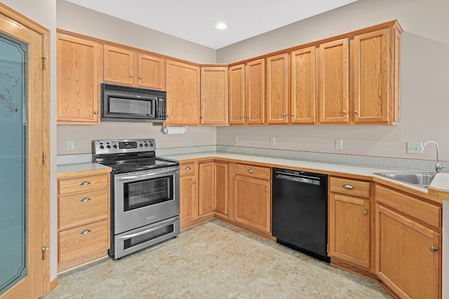 42 Pullman Ave, Saint Paul Park, MN 55071 - kitchen with black appliances, light countertops, and recessed lighting