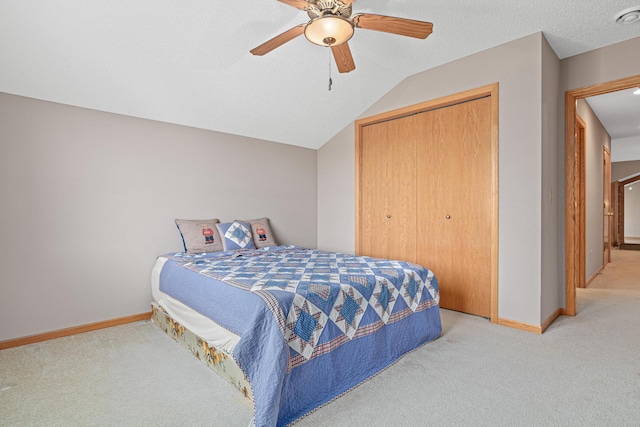 42 Pullman Ave, Saint Paul Park, MN 55071 - bedroom featuring light carpet, a closet, ceiling fan, and vaulted ceiling