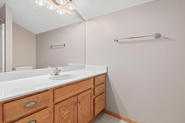 42 Pullman Ave, Saint Paul Park, MN 55071 - bathroom featuring a textured ceiling, vanity, and tile patterned flooring
