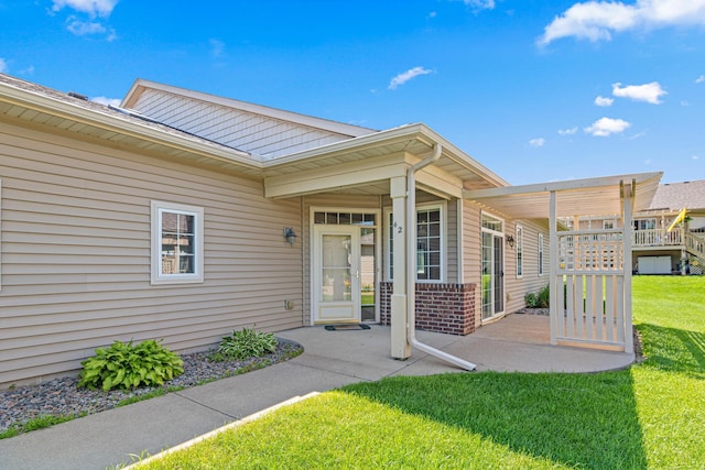 42 Pullman Ave, Saint Paul Park, MN 55071 - entrance to property with a lawn and brick siding