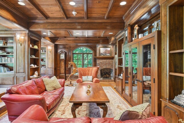 17950 Breezy Point Rd, Woodland, MN 55391 - living area featuring a wood ceiling with exposed beams, wood walls, french doors, ornamental molding, and a fireplace
