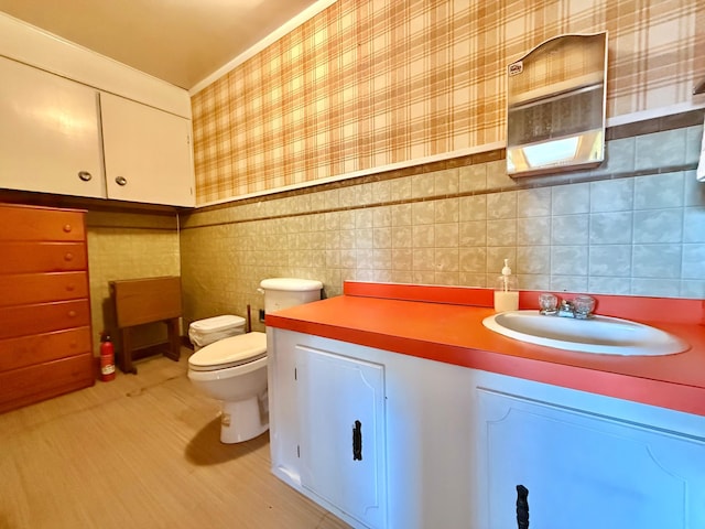 12900 350th Ave SE, Deer Park Twp, MN 56684 - bathroom with vanity and tile walls