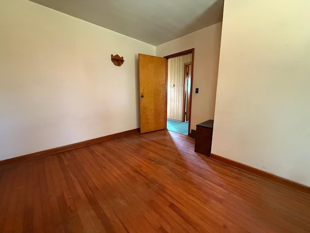 12900 350th Ave SE, Deer Park Twp, MN 56684 - spare room featuring hardwood / wood-style flooring and baseboards