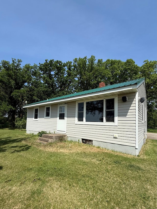 12900 350th Ave SE, Deer Park Twp, MN 56684 - view of front of home with a front lawn, crawl space, and a metal roof