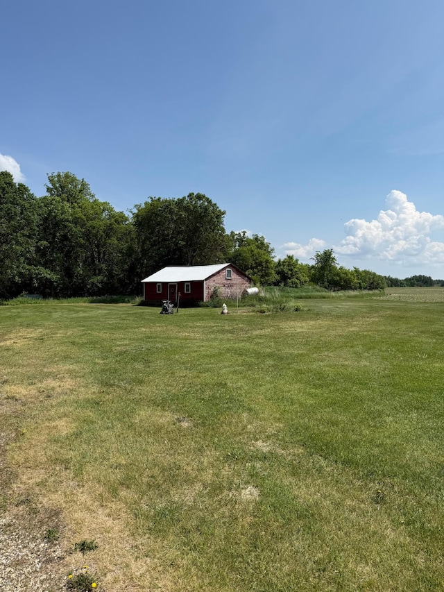 12900 350th Ave SE, Deer Park Twp, MN 56684 - view of grassy yard with an outbuilding, a view of countryside, and a barn
