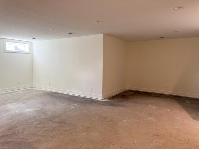 5260 Polaris Ln, Plymouth, MN 55446 - spare room with unfinished concrete floors and baseboards