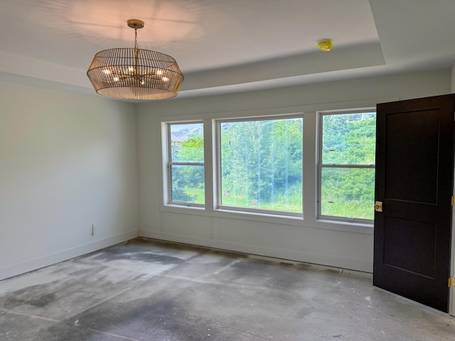 5260 Polaris Ln, Plymouth, MN 55446 - empty room with concrete flooring and a chandelier