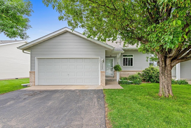 1533 Dublin Ct, Shakopee, MN 55379 - view of front of house with brick siding, a front lawn, driveway, and a garage