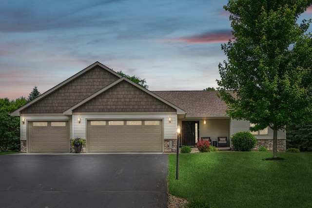 1364 Island View Dr, New Richmond, WI 54017 - craftsman inspired home with stone siding, asphalt driveway, an attached garage, and a yard