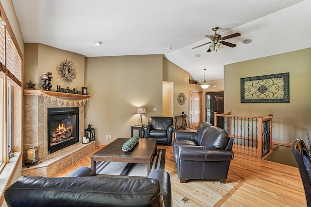 1364 Island View Dr, New Richmond, WI 54017 - living room with a fireplace, lofted ceiling, a ceiling fan, and wood finished floors