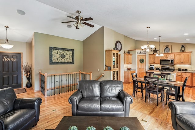 1364 Island View Dr, New Richmond, WI 54017 - living area featuring vaulted ceiling, a ceiling fan, a chandelier, light wood-type flooring, and recessed lighting