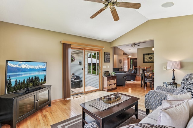 1364 Island View Dr, New Richmond, WI 54017 - living area featuring a ceiling fan, vaulted ceiling, and light wood-style flooring