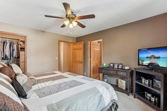 1364 Island View Dr, New Richmond, WI 54017 - bedroom featuring light carpet, ceiling fan, a spacious closet, a textured ceiling, and a closet