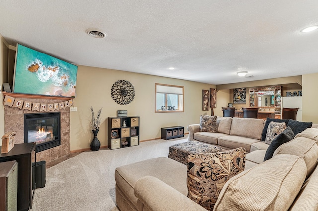 1364 Island View Dr, New Richmond, WI 54017 - living room featuring carpet floors, a textured ceiling, a fireplace, recessed lighting, and bar area