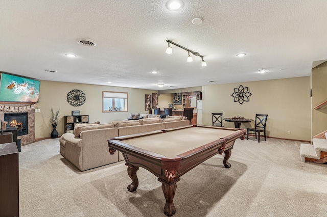 1364 Island View Dr, New Richmond, WI 54017 - rec room with light colored carpet, a tiled fireplace, pool table, a textured ceiling, and recessed lighting